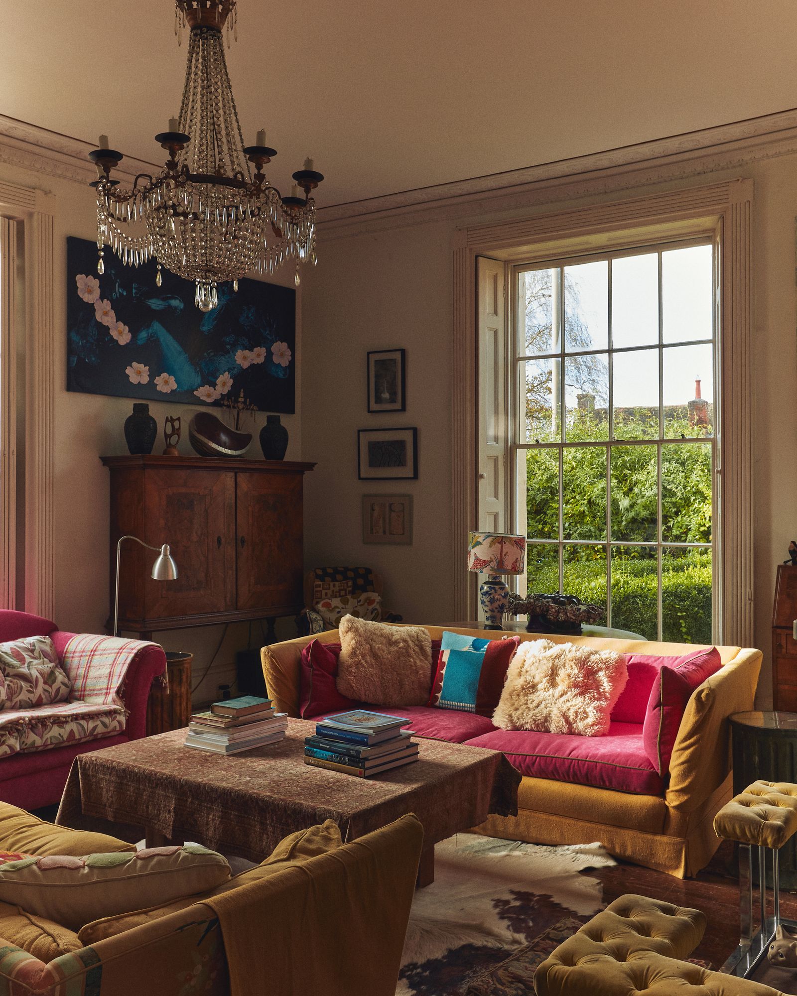 Image may contain Home Decor Lamp Couch Furniture Art Painting Architecture Building Indoors Living Room and Room