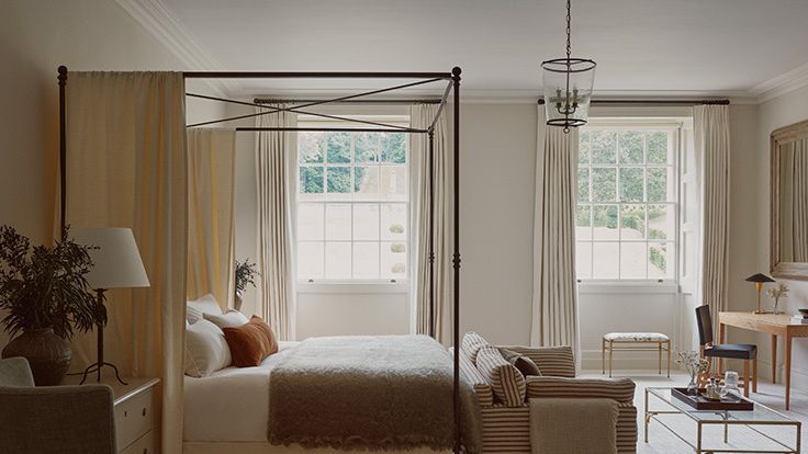 Image may contain: Furniture, Bed, Bedroom, Indoors, Room, Plant, Lamp, Chair, Desk, Table, Couch, and Canopy Bed