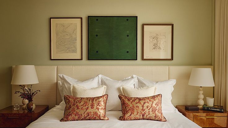 Image may contain: Cushion, Home Decor, Lamp, Pillow, Bed, Furniture, Table Lamp, Art, Painting, Cup, and Indoors