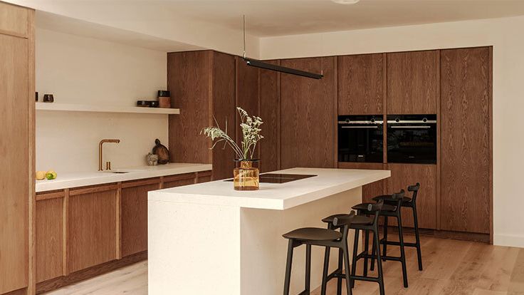 Image may contain: Indoors, Interior Design, Kitchen, Kitchen Island, Chair, Furniture, Appliance, and Device