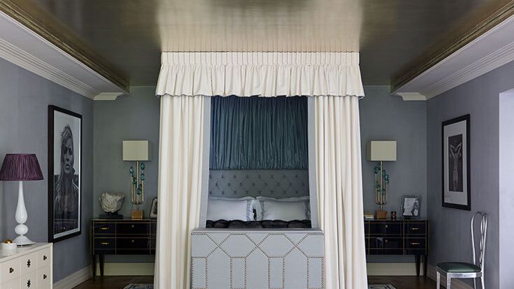 Image may contain: Lamp, Home Decor, Chair, Furniture, Rug, Art, Painting, Bed, Bedroom, Indoors, Room, and Interior Design