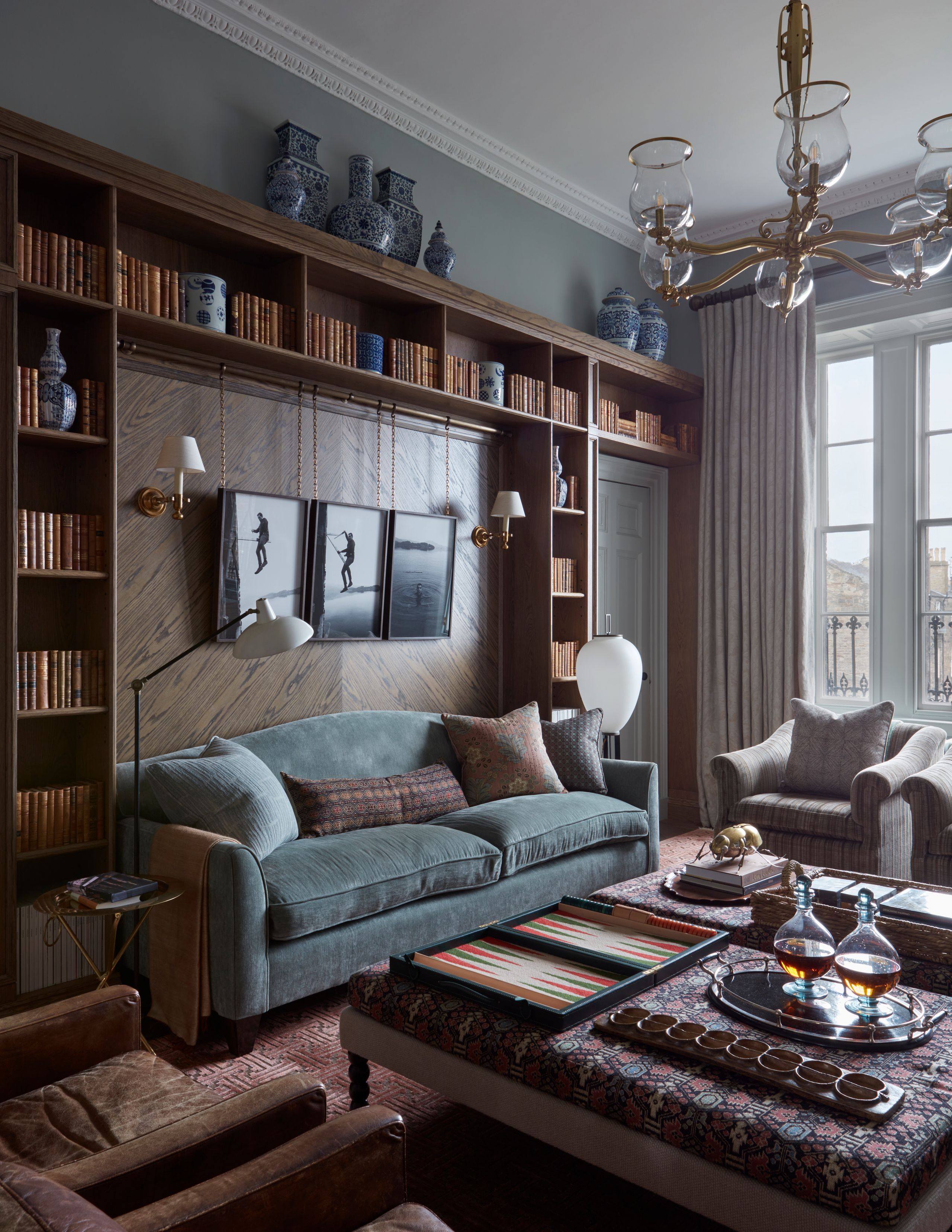 Image may contain: Home Decor, Lamp, Couch, Furniture, Architecture, Building, Indoors, Living Room, and Room