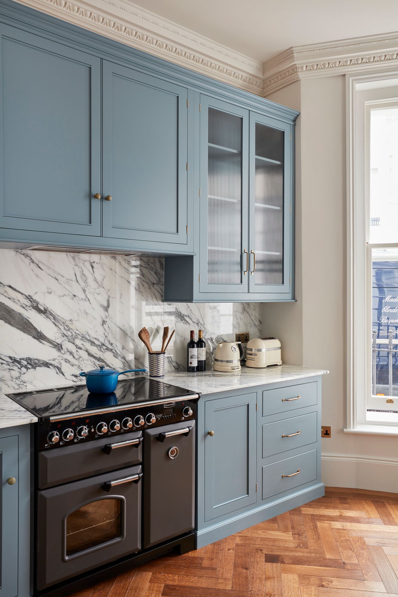 Image may contain: Indoors, Interior Design, Kitchen, Cooktop, Sink, Sink Faucet, Furniture, and Cup