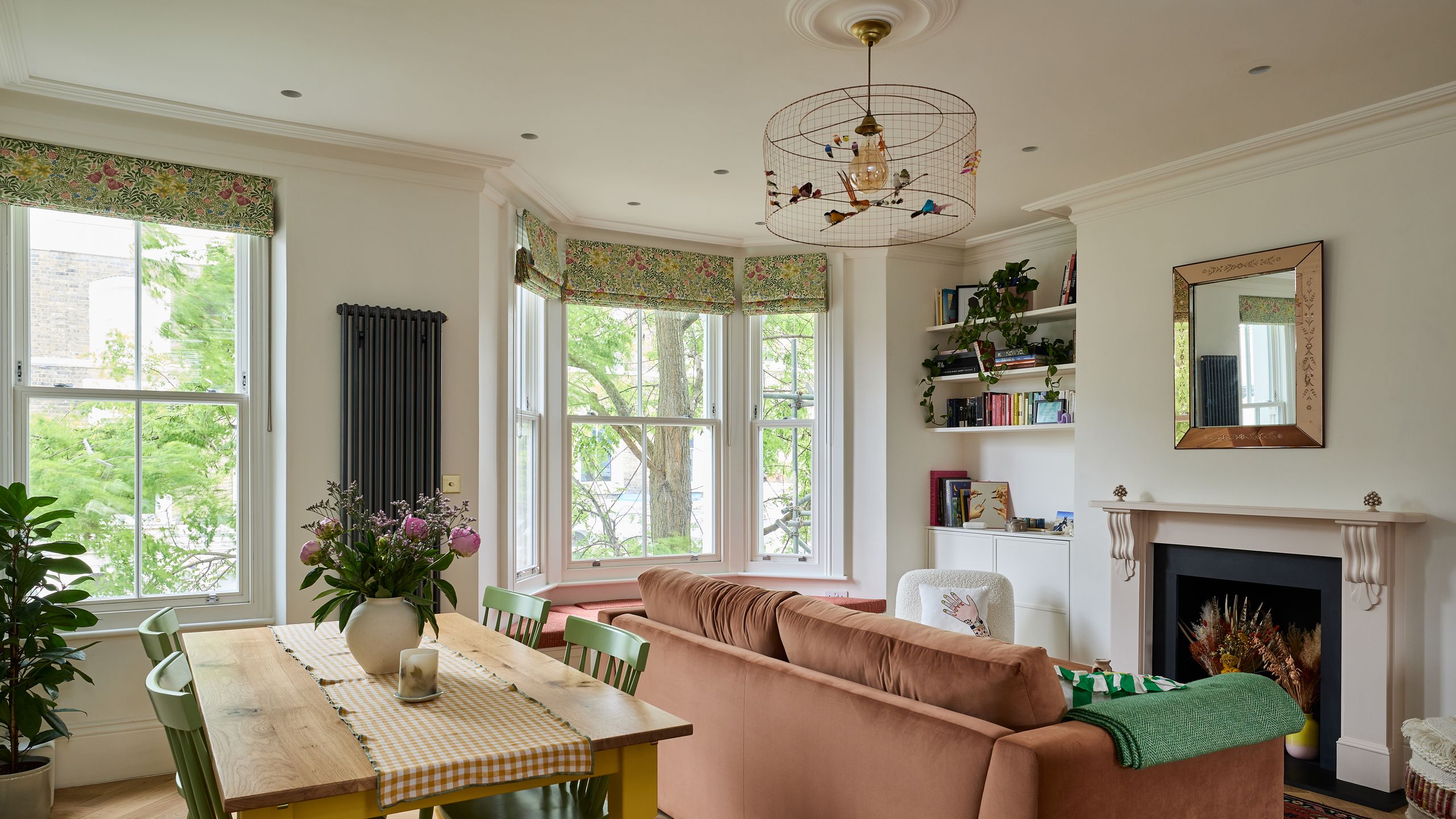 Image may contain: Plant, Home Decor, Lamp, Chair, Furniture, Table, Cup, Couch, Window, Architecture, Building, and Indoors