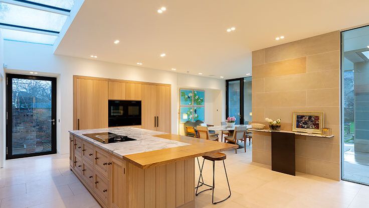 Image may contain: Indoors, Interior Design, Kitchen, Floor, Flooring, Kitchen Island, and Cooktop