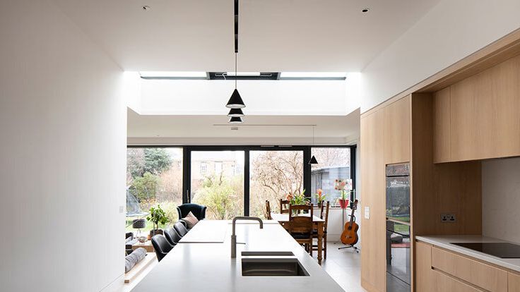 Image may contain: Indoors, Interior Design, Plant, Sink, Sink Faucet, Guitar, Musical Instrument, Kitchen, and Cooktop