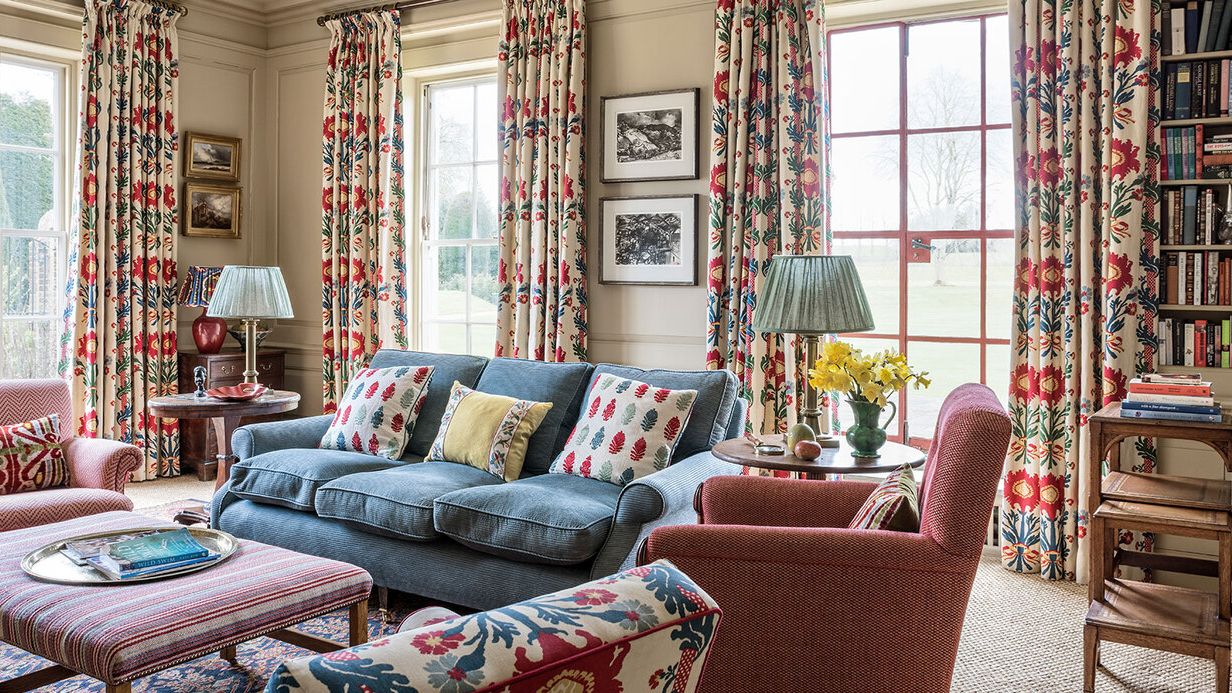 Image may contain: Home Decor, Lamp, Couch, Furniture, Art, Painting, Desk, Table, and Plate