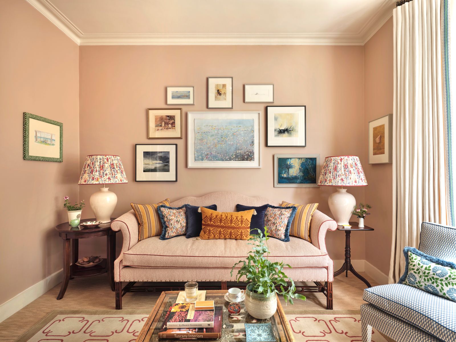 Image may contain Home Decor Architecture Building Furniture Indoors Living Room Room Plant Cushion Lamp and Couch