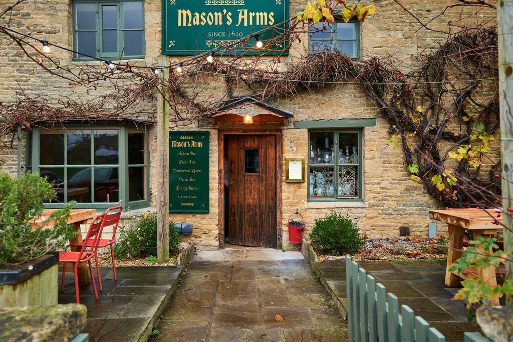 Image may contain Path Walkway Plant City Potted Plant Architecture Building Hotel Chair Furniture and Road