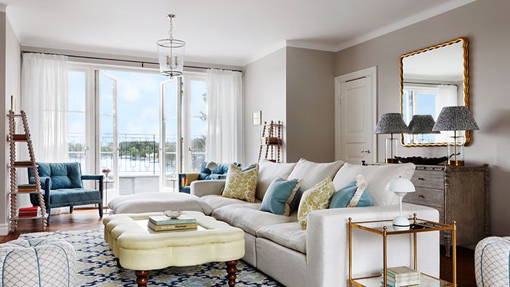 Image may contain: Home Decor, Lamp, Couch, Furniture, Rug, Chair, Table, Architecture, Building, Indoors, and Living Room