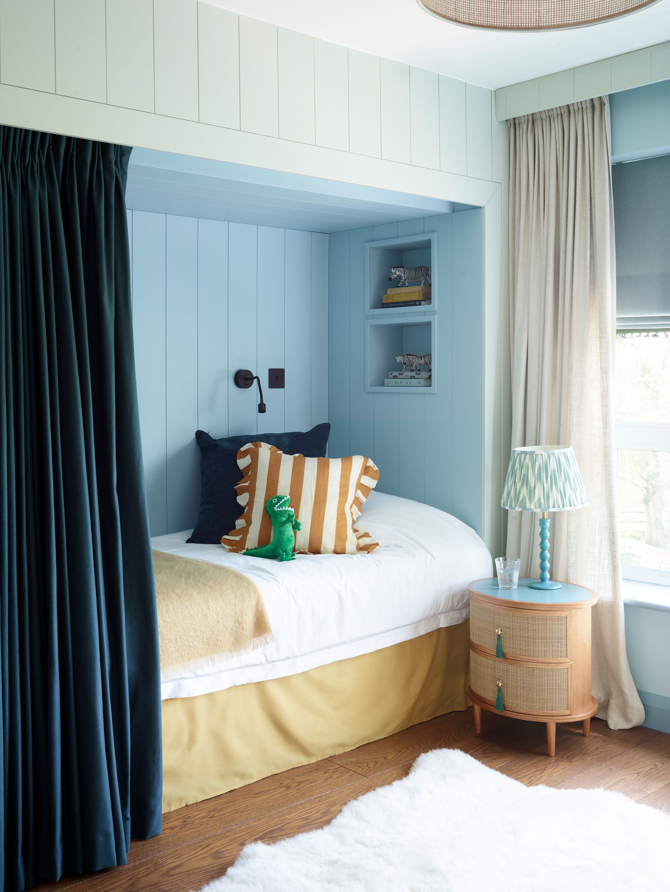 Image may contain: Indoors, Interior Design, Home Decor, Rug, Lamp, Cushion, Corner, Cup, Bed, Furniture, Bedroom, and Room