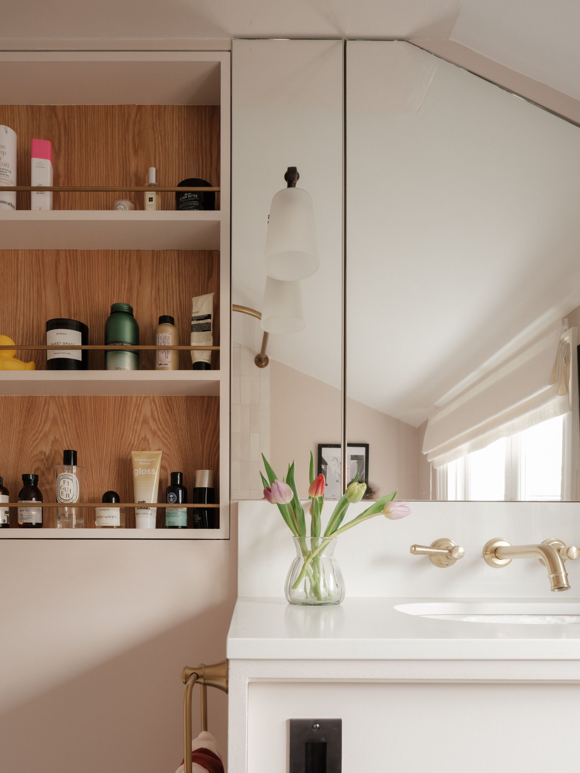 Image may contain: Cabinet, Furniture, Indoors, Interior Design, Art, Painting, Sink, Sink Faucet, Cup, and Candle