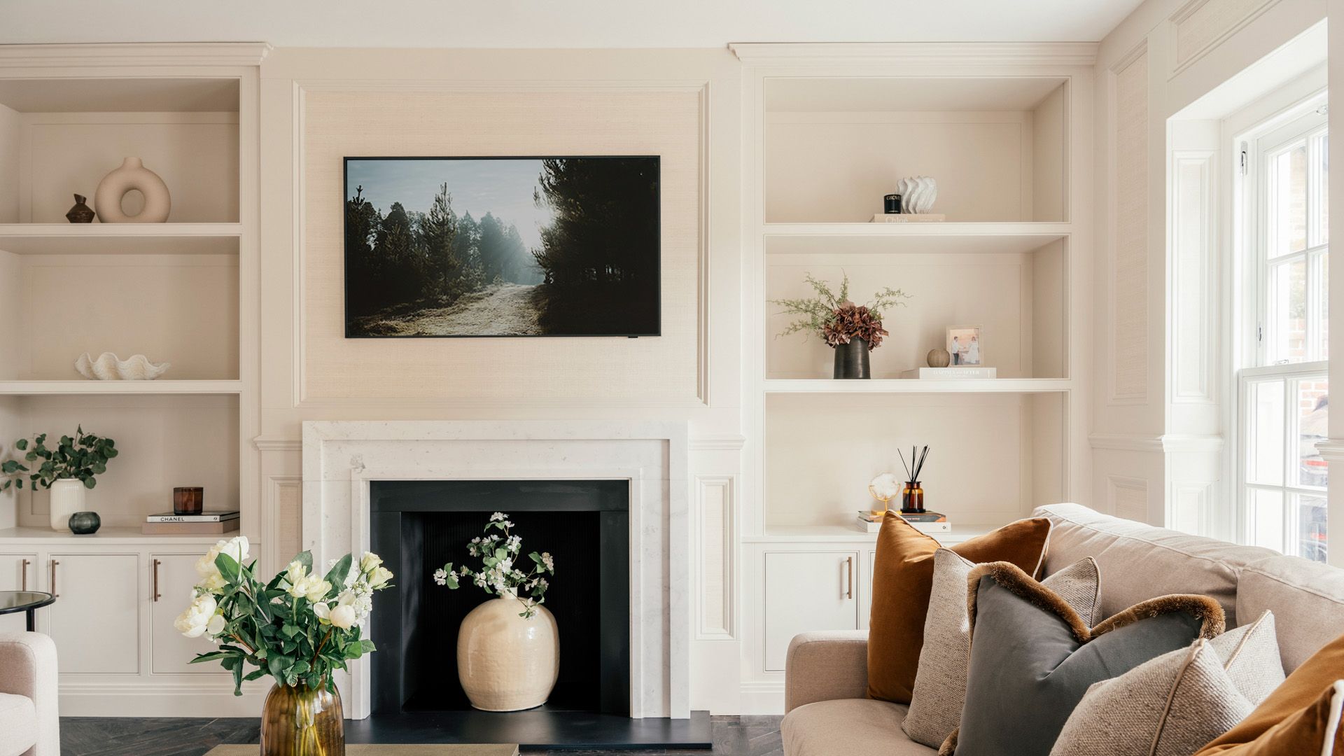 Image may contain: Home Decor, Fireplace, Indoors, Interior Design, Architecture, Building, Furniture, Living Room, and Room