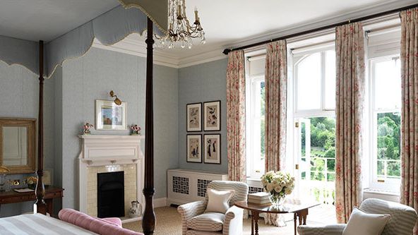 Image may contain: Home Decor, Furniture, Architecture, Building, Indoors, Living Room, Room, Art, Painting, Desk, and Table