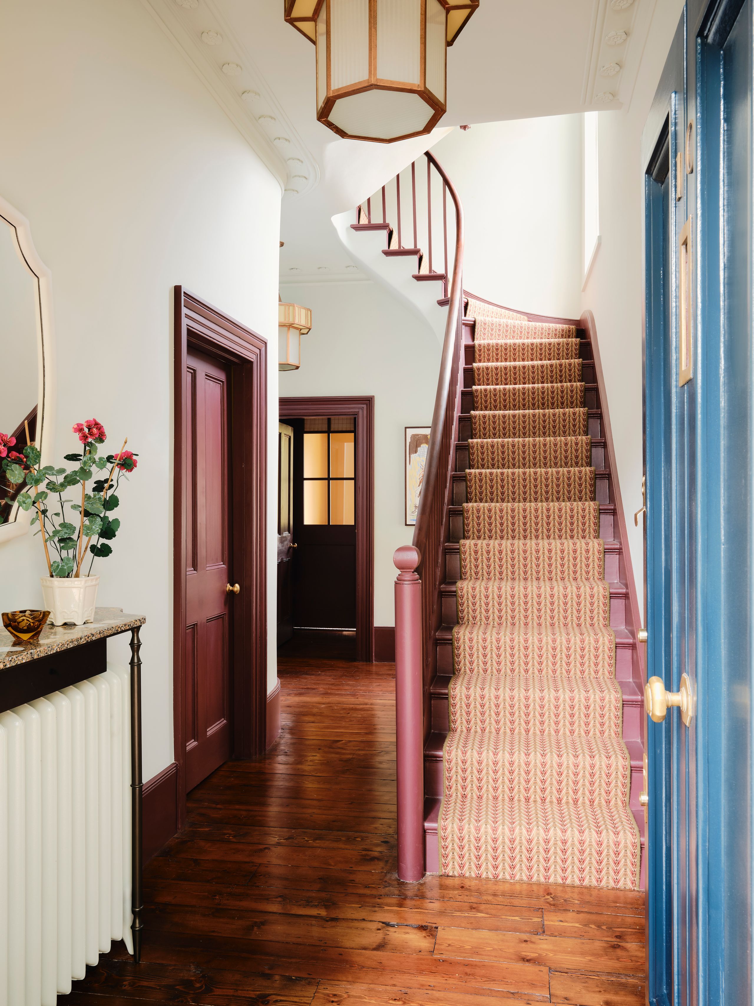 Image may contain: Architecture, Building, Foyer, Indoors, Lamp, Art, and Painting