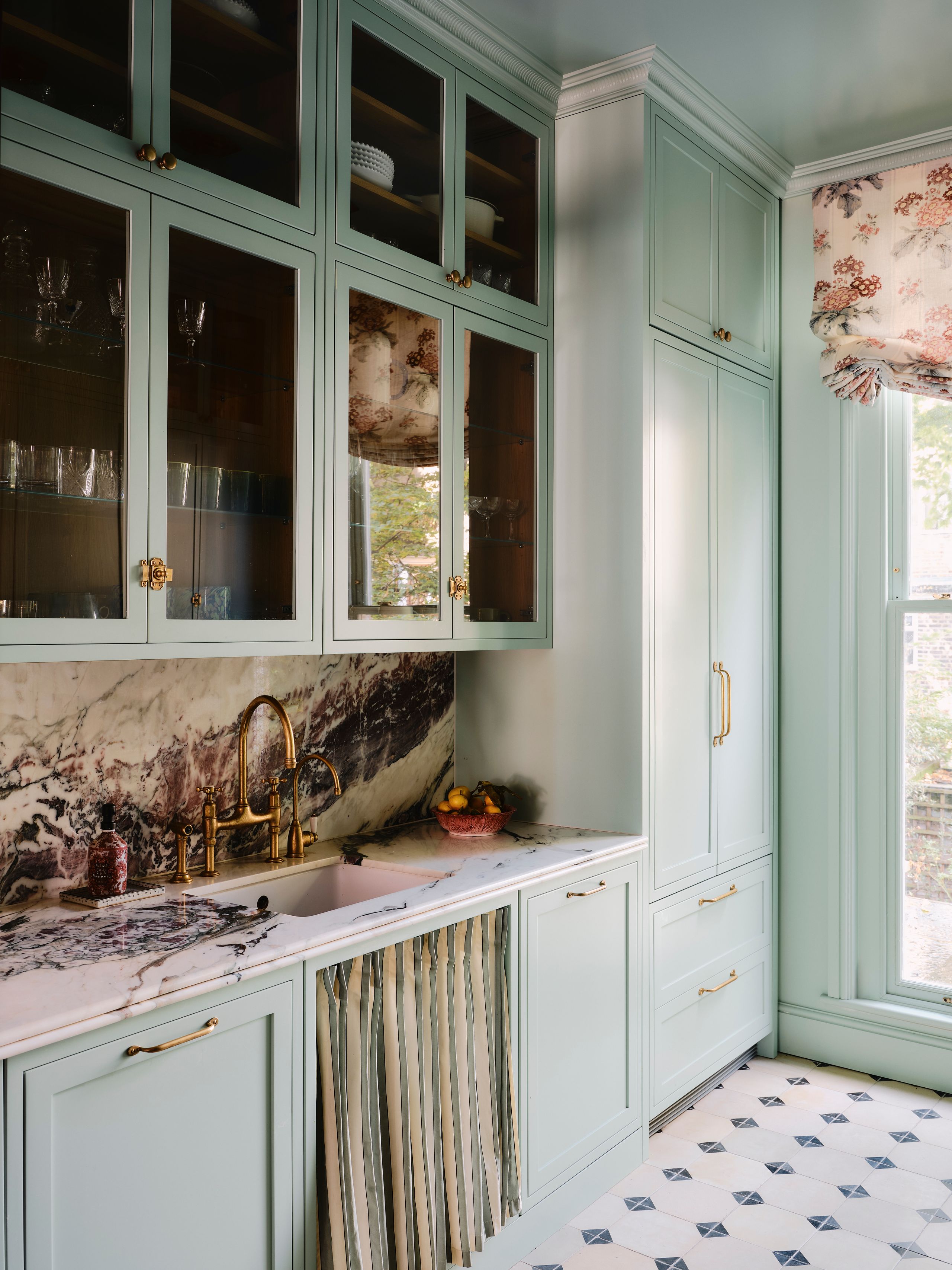 Image may contain: Indoors, Interior Design, Sink, Sink Faucet, Furniture, Cup, and Cabinet