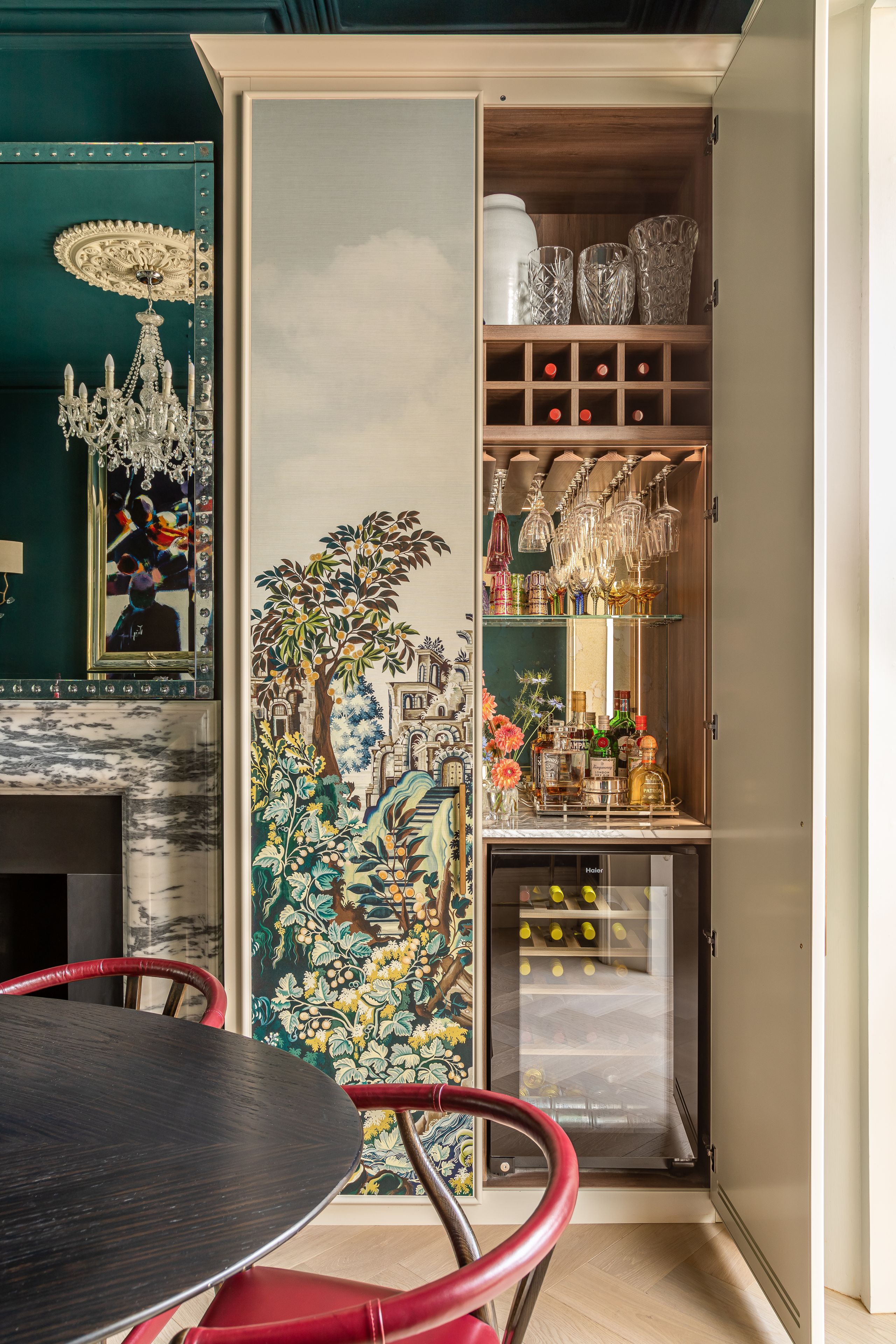 Image may contain: Indoors, Interior Design, Shelf, Lamp, Chair, Furniture, Desk, Table, Person, Pantry, and Appliance