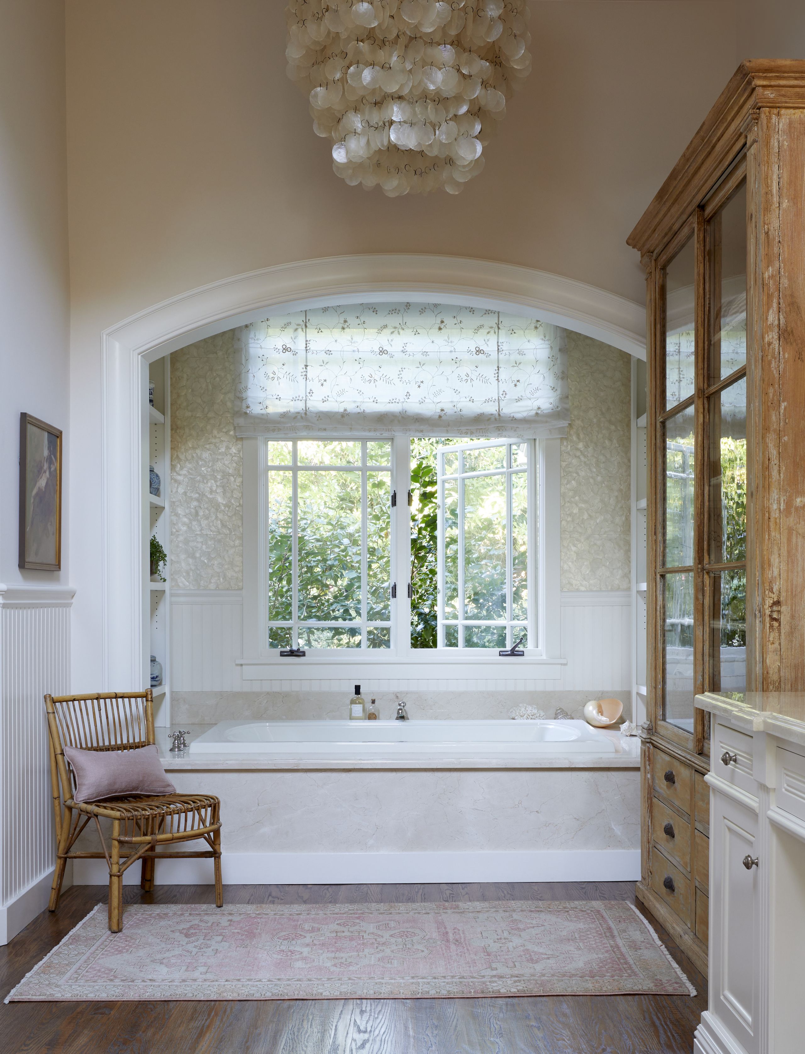 Image may contain: Chair, Furniture, Home Decor, Rug, Chandelier, Lamp, Art, Painting, Window, Indoors, and Interior Design