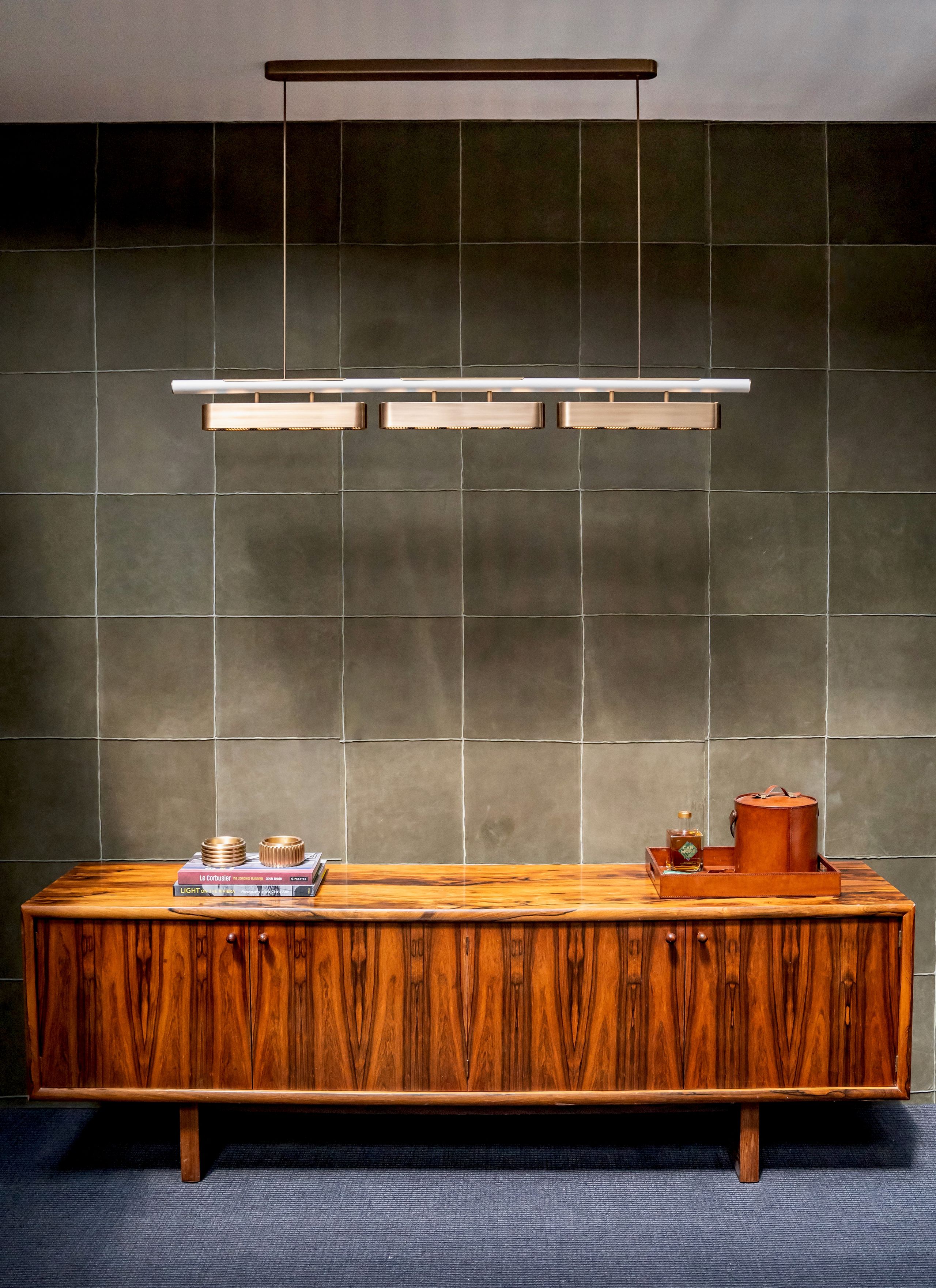 Image may contain: Indoors, Interior Design, Furniture, Sideboard, Wood, Hardwood, Plywood, Kitchen, Desk, and Table