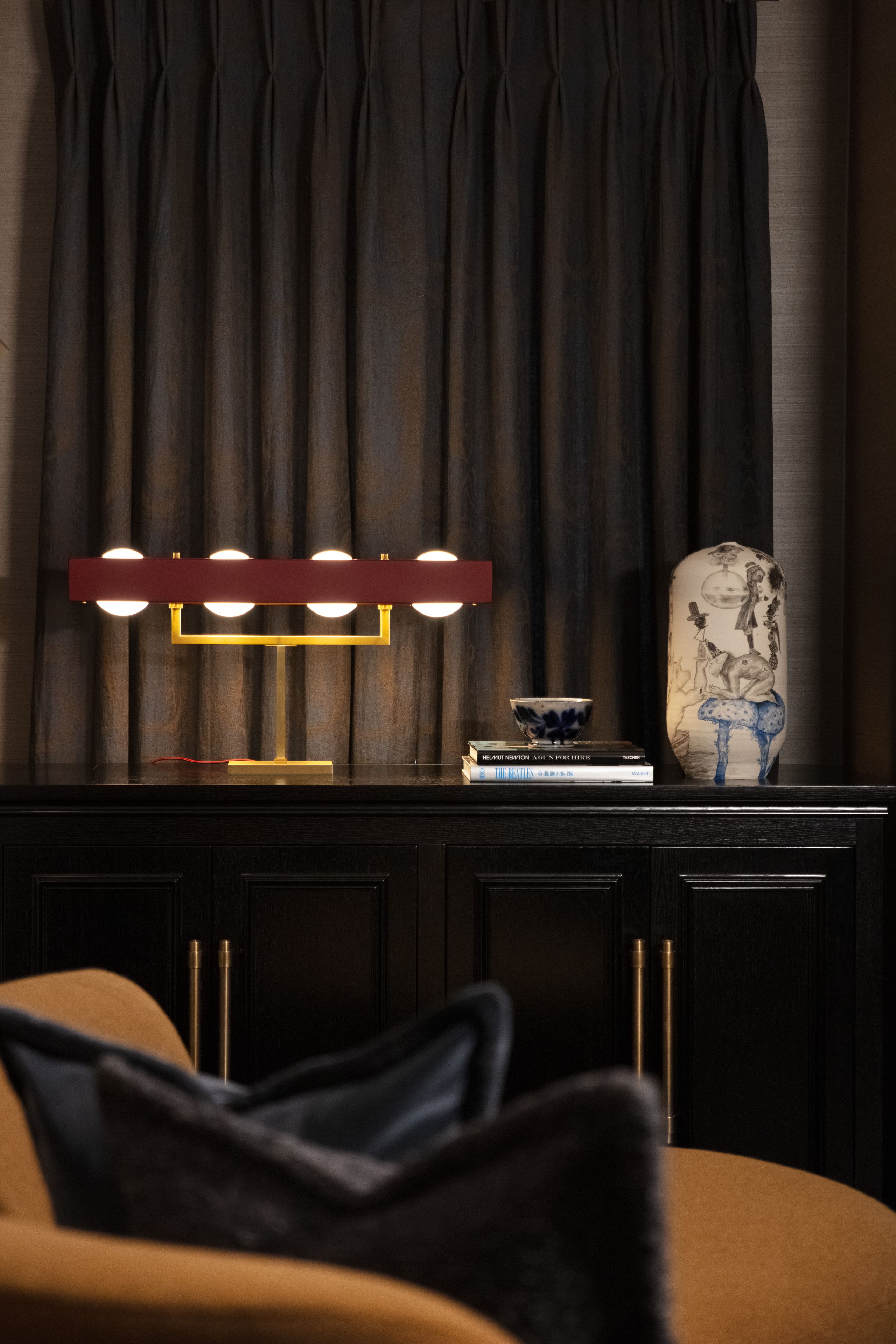 Image may contain: Indoors, Interior Design, Lamp, Architecture, Building, Furniture, Living Room, Room, and Book