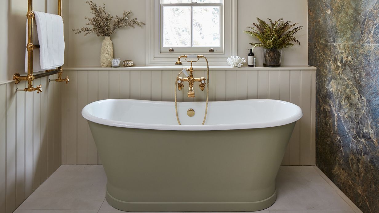 Image may contain: Bathing, Bathtub, Person, Tub, Plant, and Indoors