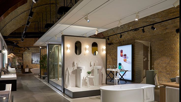 Image may contain: Plant, Indoors, Bathing, Bathtub, Person, Tub, Desk, Furniture, Table, Lamp, Sink, and Sink Faucet