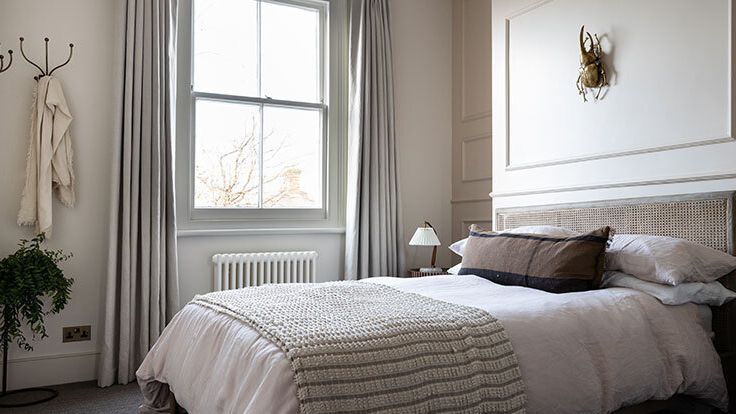 Image may contain: Lamp, Bed, Furniture, Indoors, Interior Design, Home Decor, Linen, Bedroom, Room, Plant, and Cushion