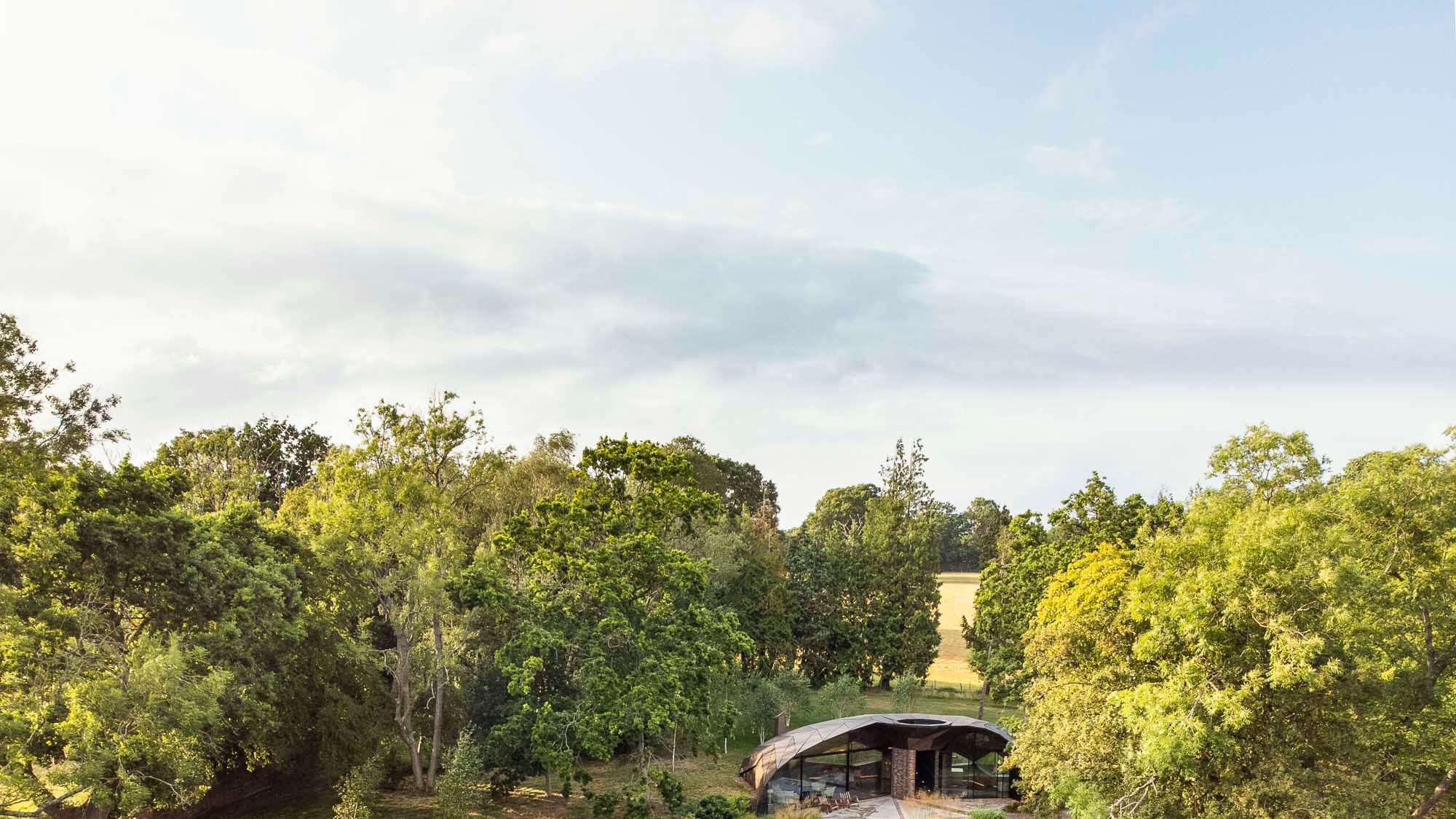 Image may contain: Grass, Nature, Outdoors, Park, Plant, Land, Tree, Vegetation, Woodland, Garden, Architecture, and Building