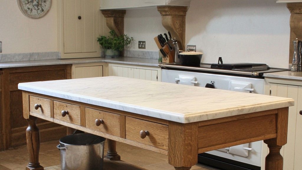 Image may contain: Indoors, Kitchen, Kitchen Island, Plant, Furniture, Table, and Wood