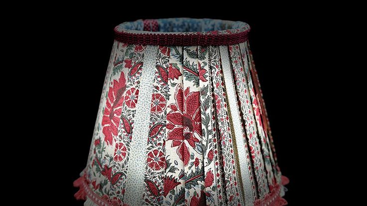 Image may contain: Lamp, Lampshade, Clothing, and Skirt