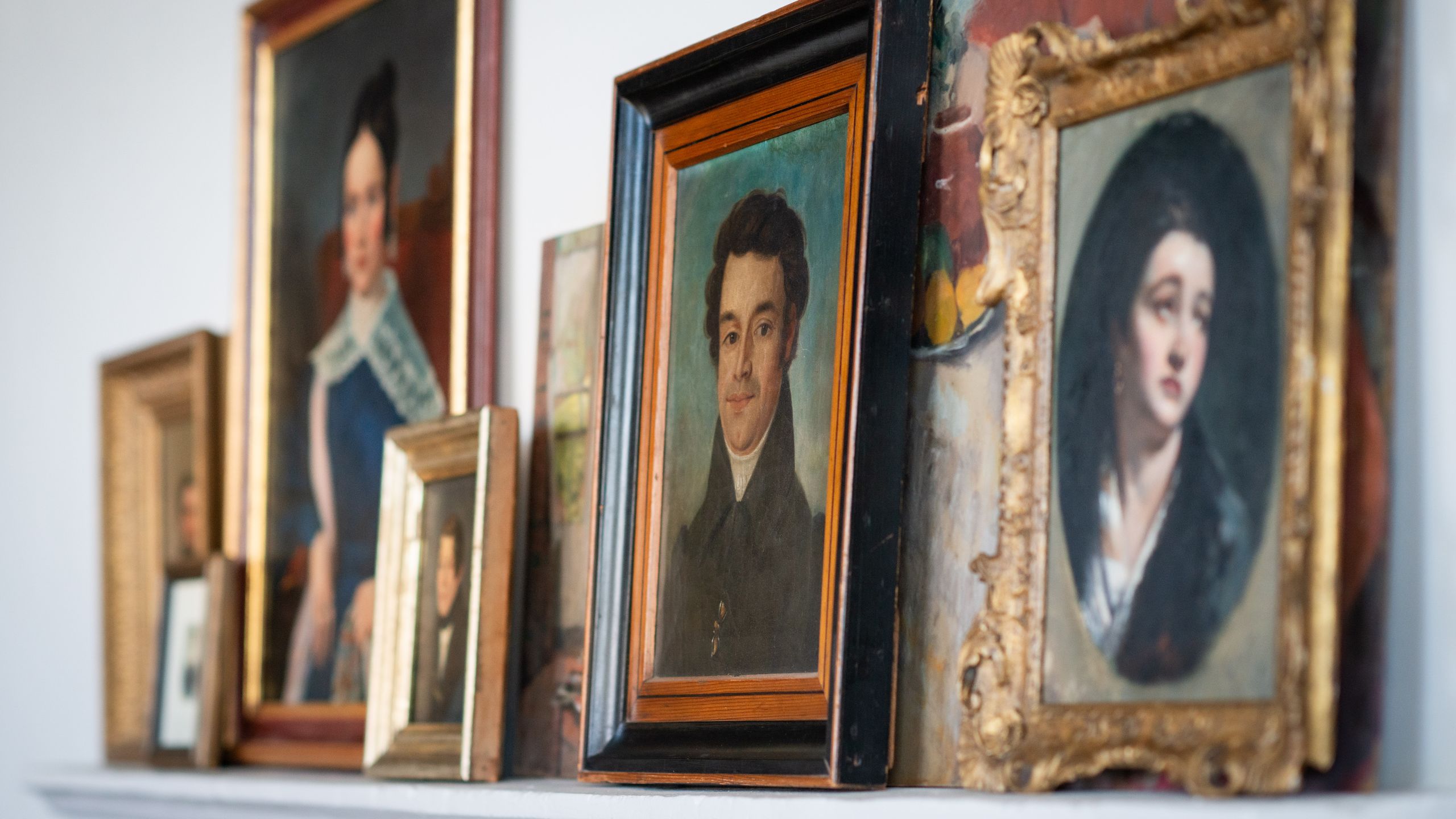 Image may contain: Art, Painting, Adult, Person, Art Gallery, and Photo Frame