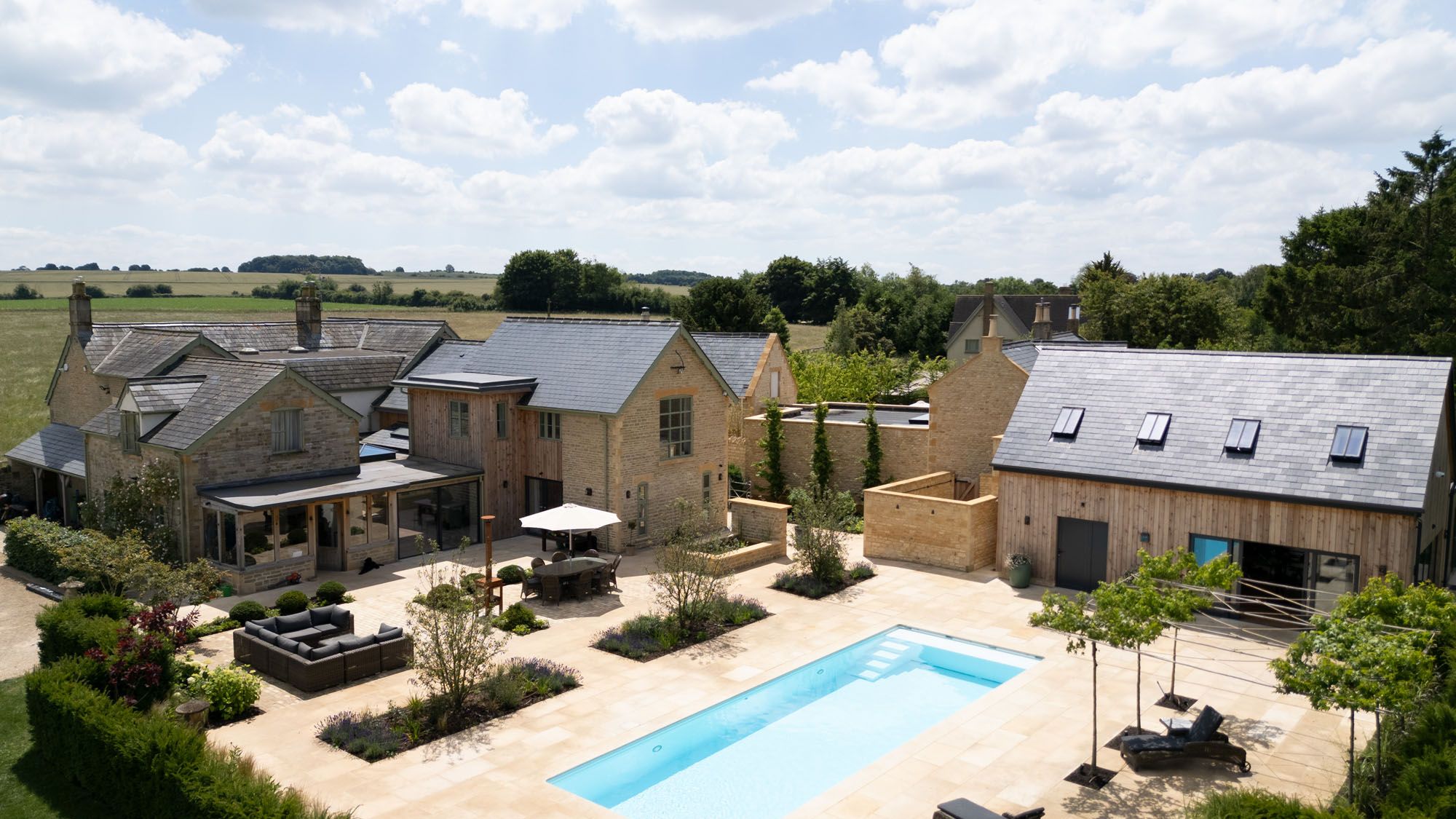 Image may contain: Outdoors, Pool, Water, Swimming Pool, Chair, Furniture, Backyard, Nature, Yard, and Aerial View