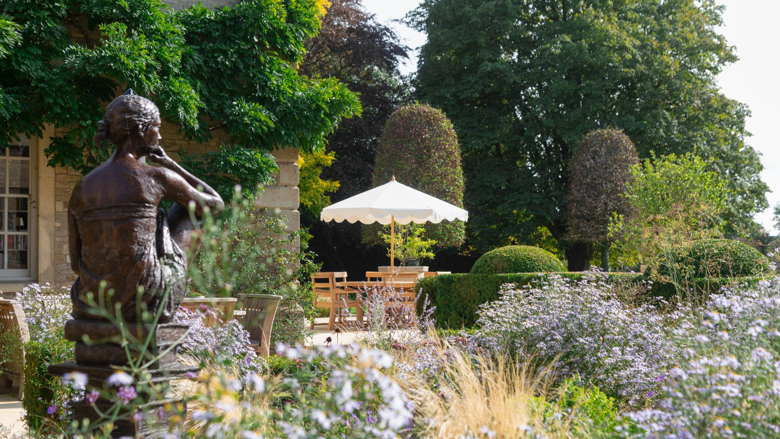 Image may contain: Garden, Nature, Outdoors, Grass, Plant, Potted Plant, Vegetation, Herbal, Herbs, Adult, Person, and Park