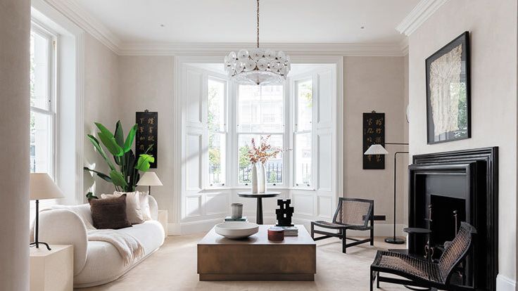 Image may contain: Home Decor, Lamp, Couch, Furniture, Chair, Architecture, Building, Indoors, Living Room, Room, and Rug