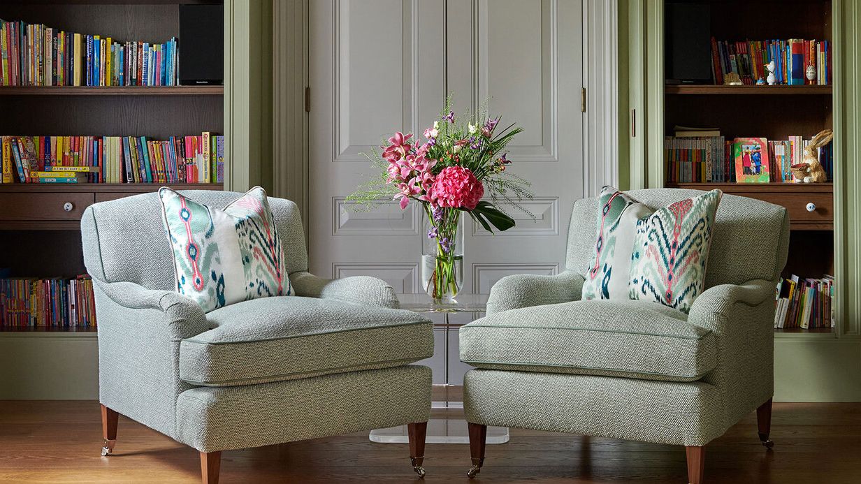 Image may contain: Furniture, Chair, Cushion, Home Decor, Couch, Architecture, Building, Indoors, Living Room, and Room