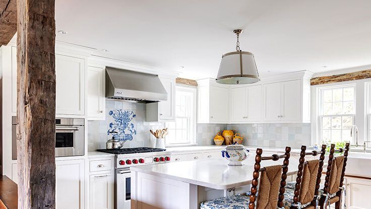 Image may contain: John Sullivan, Indoors, Kitchen, Interior Design, Kitchen Island, Chair, Furniture, Home Decor, and Rug