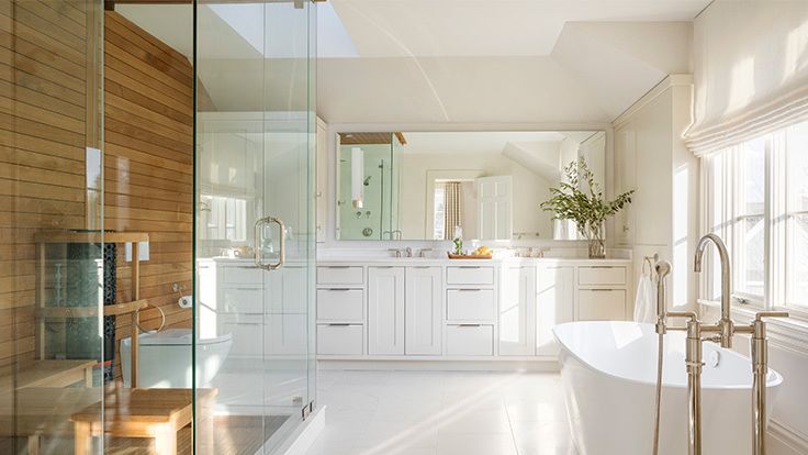 Image may contain: Indoors, Interior Design, Bathing, Bathtub, Person, Tub, Sink, Sink Faucet, Floor, and Flooring