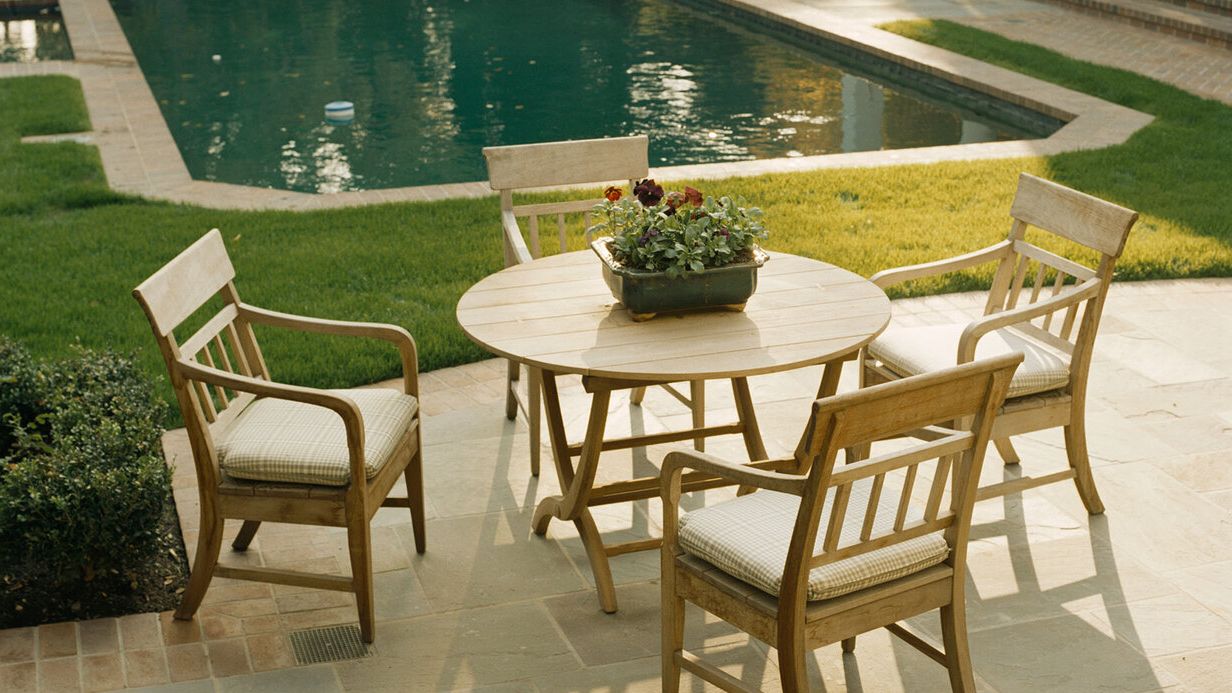 Image may contain: Furniture, Table, Dining Table, Chair, Nature, Outdoors, Scenery, Desk, Tabletop, Backyard, and Yard