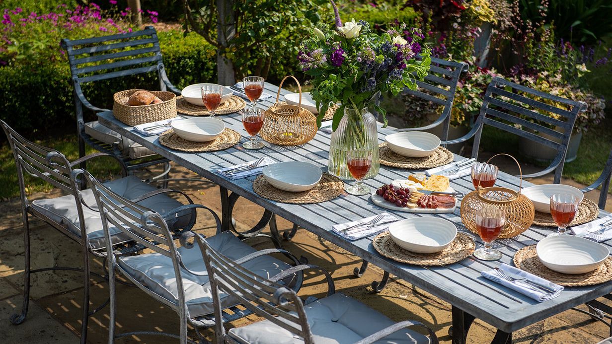 Image may contain: Furniture, Table, Tabletop, Brunch, Food, Chair, Dining Table, Cup, Plate, Outdoors, Bread, and Nature