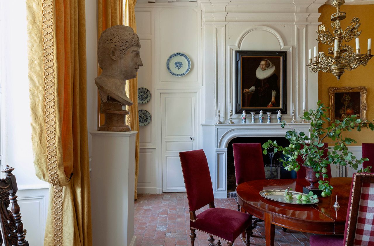 Image may contain: Phidias, Mercy Otis Warren, Lamp, Architecture, Building, Dining Room, Dining Table, and Furniture