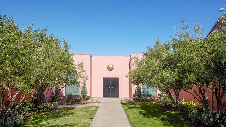 Image may contain: Architecture, Building, House, Housing, Villa, Hacienda, Grass, Plant, Outdoors, and Vegetation