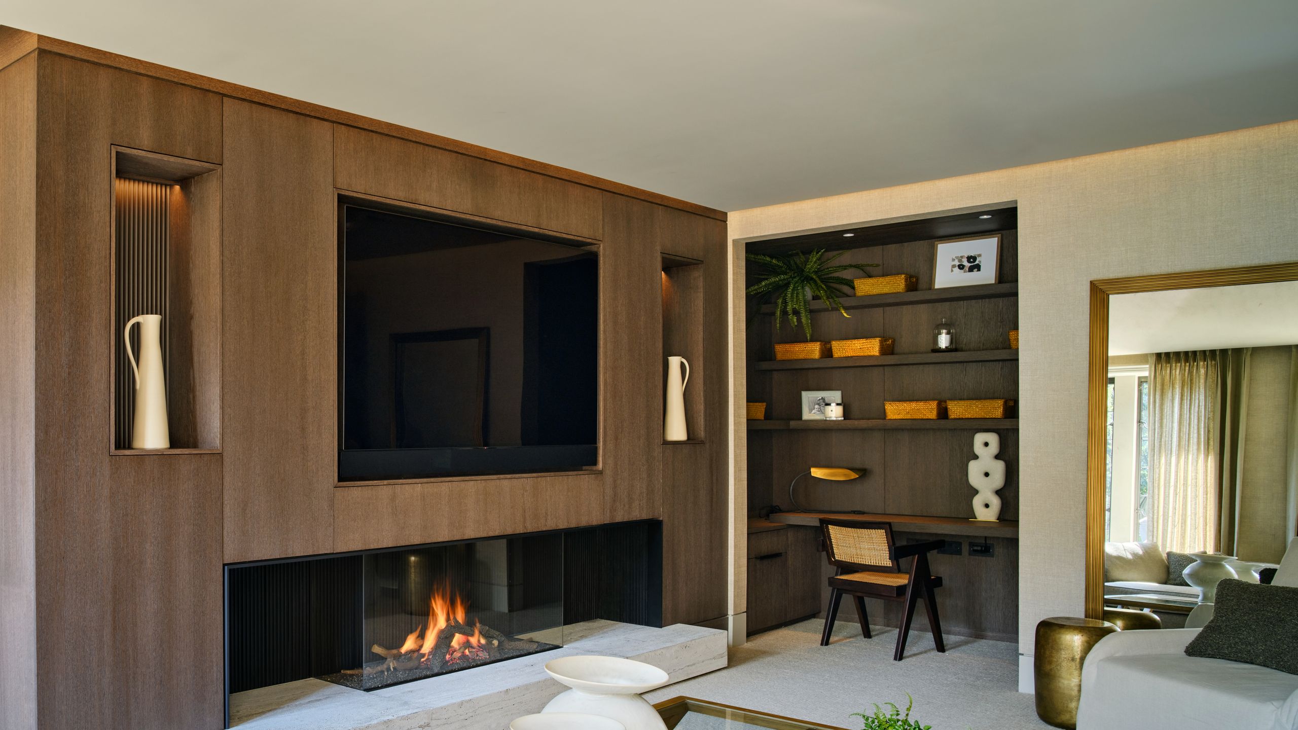 Image may contain: Indoors, Interior Design, Fireplace, Coffee Table, Furniture, Table, Architecture, and Building