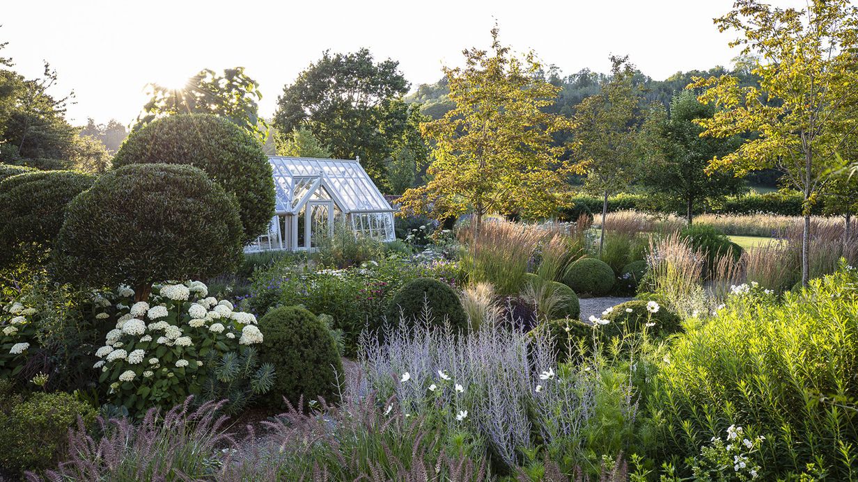 Image may contain: Garden, Nature, Outdoors, Architecture, Building, Cottage, House, Housing, Grass, Plant, and Vegetation