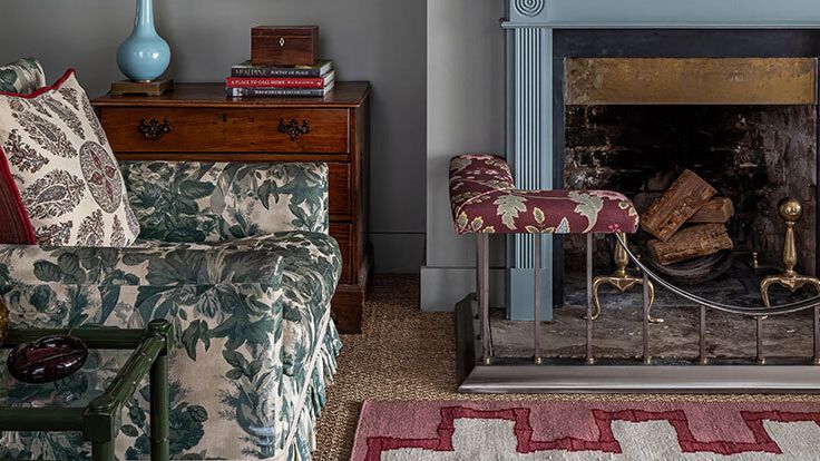 Image may contain: Home Decor, Rug, Fireplace, Indoors, Couch, Furniture, Cushion, and Box