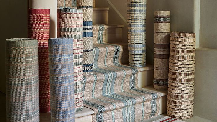 Image may contain: Home Decor, Architecture, Building, House, Housing, Staircase, Rug, and Linen