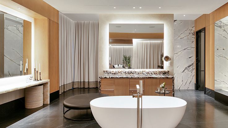 Image may contain: Bathing, Bathtub, Person, Tub, Plant, Indoors, Interior Design, and Floor