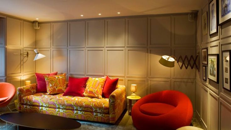 Image may contain: Architecture, Building, Furniture, Indoors, Living Room, Room, Home Decor, Couch, and Chair