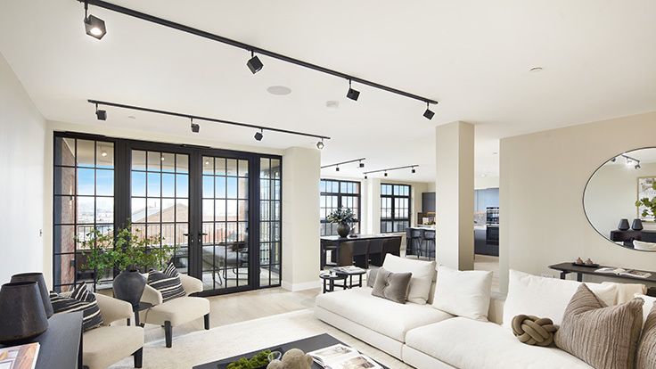 Image may contain: Architecture, Building, Furniture, Indoors, Living Room, Room, Home Decor, Couch, Coffee Table, and Table