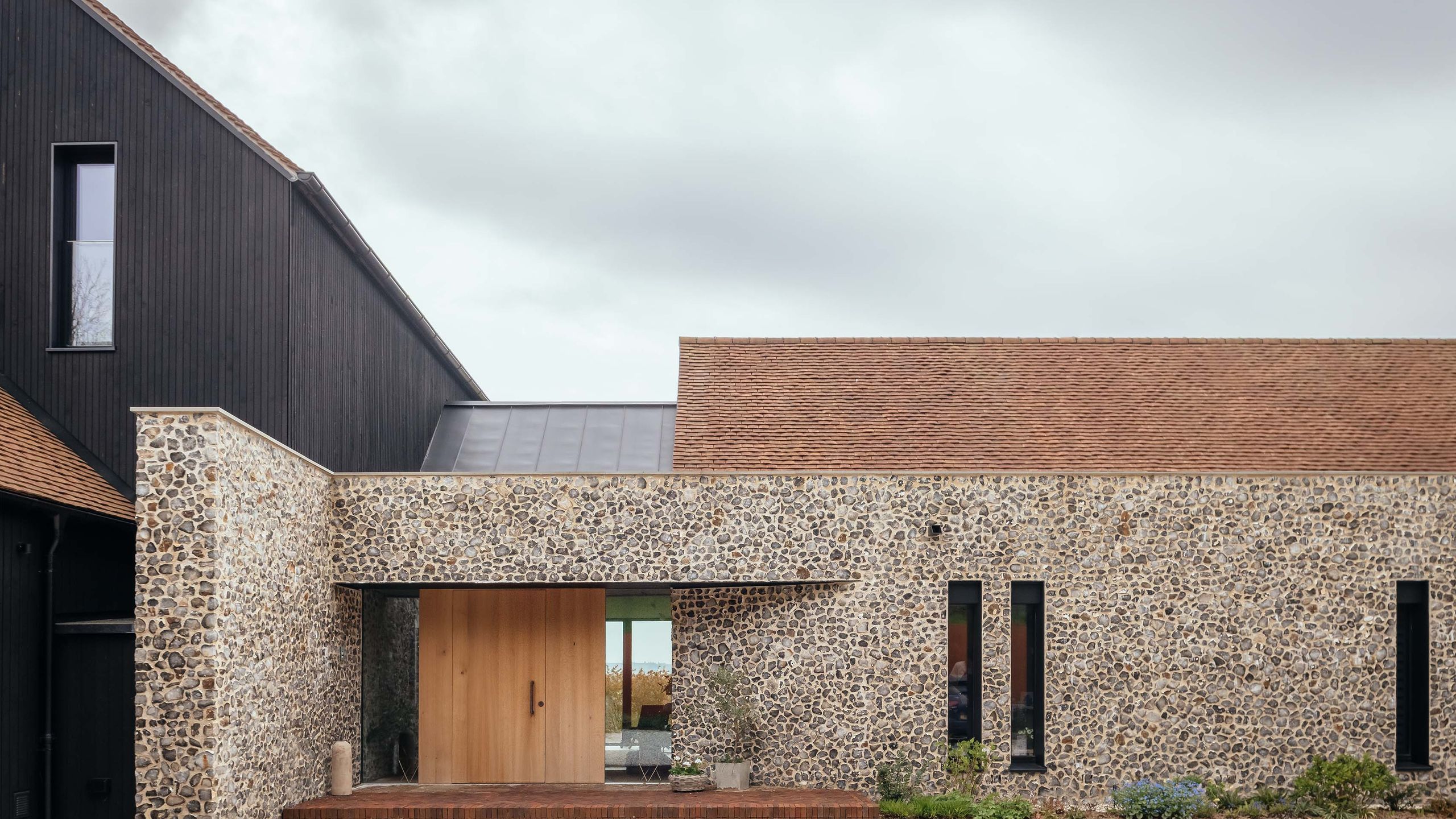 Image may contain: Indoors, Interior Design, Plant, Architecture, Building, Housing, Outdoors, Garage, House, and Villa