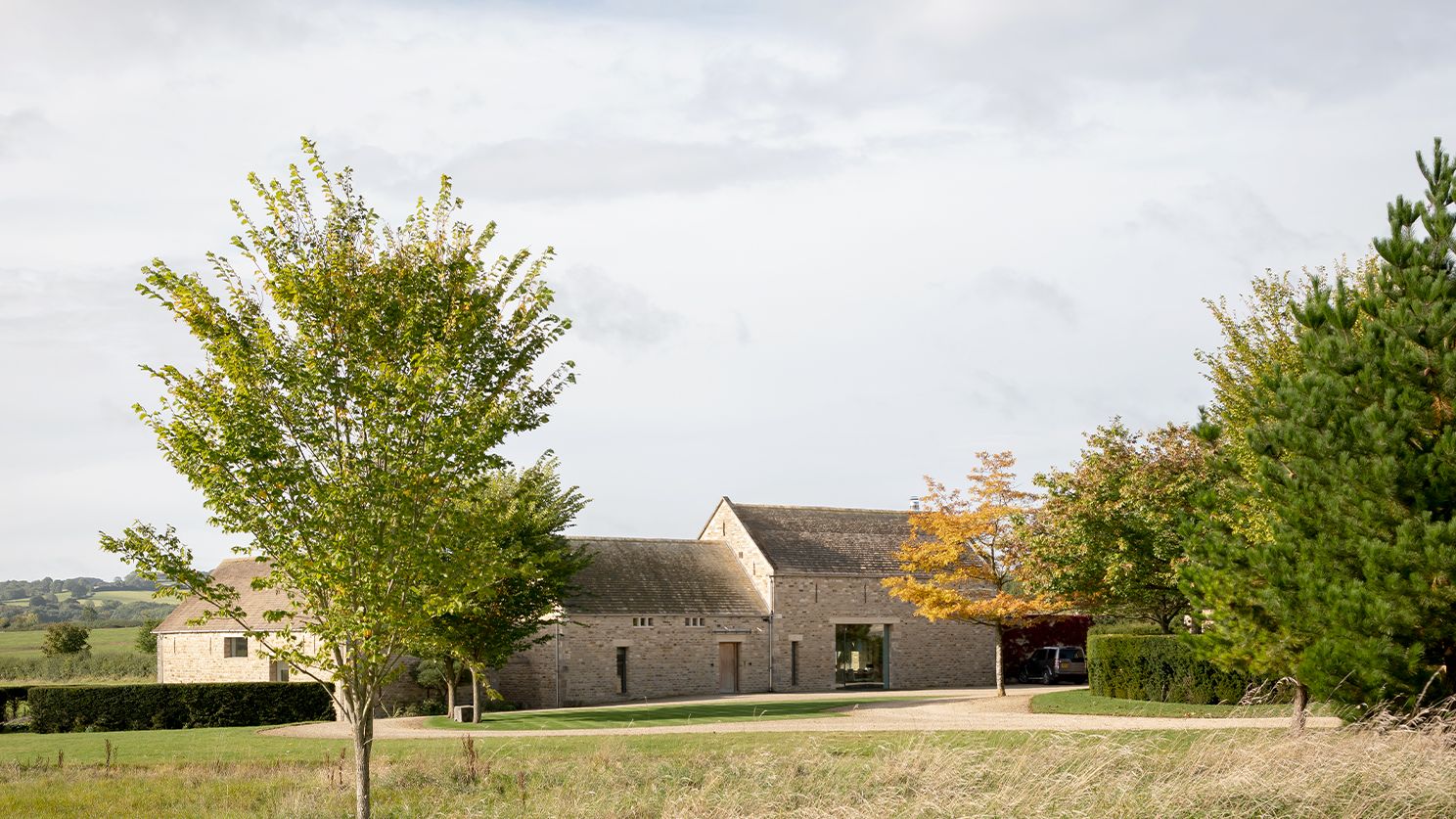 Image may contain: Grass, Plant, Architecture, Building, Cottage, House, Housing, Tree, Outdoors, Nature, and Car